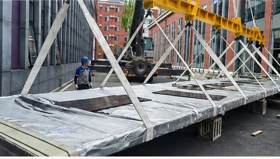Handling frame and acrylic component during the Beijing project installation