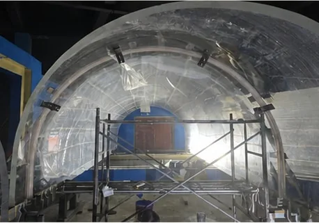 Curved tunnel assembly under installation